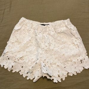 White lace shorts with a white lining. Brand of shorts is just female